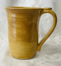 Load image into Gallery viewer, A Mug:  (Goldenrod Yellow Ceramic Mug with a Paw Print Thumb Rest)