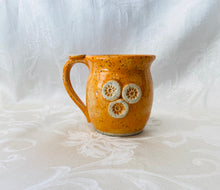 Load image into Gallery viewer, Kids Cup:  (Bright Orange on Speckled Clay with Three Flower Appliques)