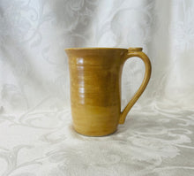 Load image into Gallery viewer, A Mug:  (Goldenrod Yellow Ceramic Mug with a Paw Print Thumb Rest)