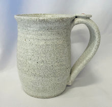 Load image into Gallery viewer, A Mug:  ( Small White Ceramic Tea Mug on Speckled Clay with a Flower Thumb Rest)