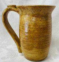Load image into Gallery viewer, A Mug:  (Goldenrod Ceramic Mug on Speckled Clay with a Daisy Thumb Rest)