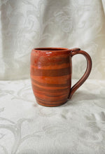 Load image into Gallery viewer, A Mug: (Peach Colored on Tri-Colored Clay with a Spiral Thumb Rest)