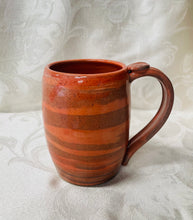 Load image into Gallery viewer, A Mug: (Peach Colored on Tri-Colored Clay with a Spiral Thumb Rest)
