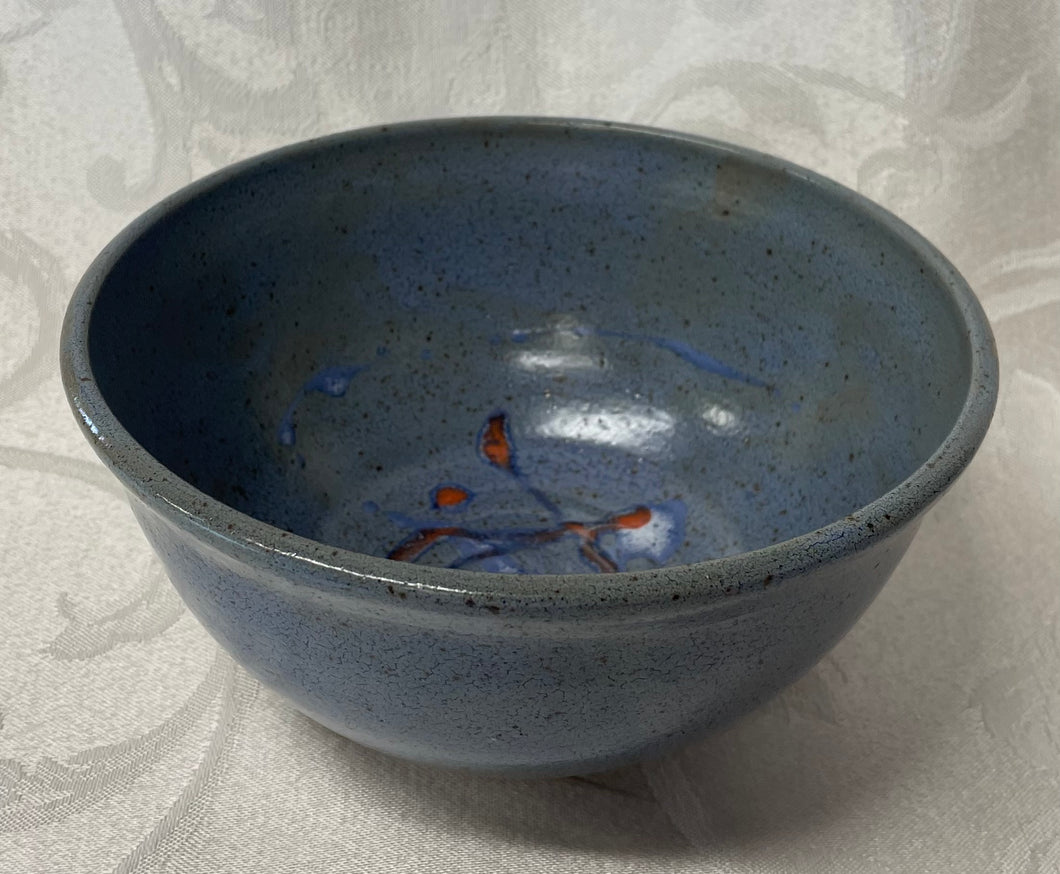Medium Bowl:  (Bluish-Gray Speckled with Orange, White, and Blue Accents)