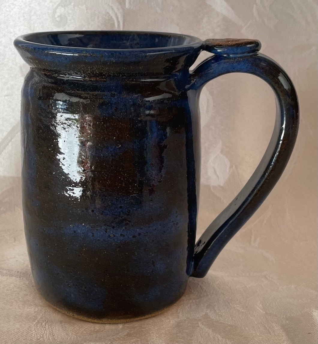 A Mug:   (Azure Blue-Black with a Spiral Thumb Rest)